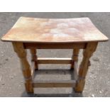 An oak Robert 'Mouseman' Thompson stool with adzed top. 40cm w x 27.5cm d x 31cm h.