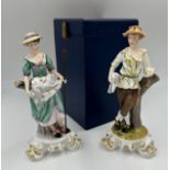 Two Royal Crown Derby figures of shepherdess with lambs and detachable metal crook. Signed Joan Lee.