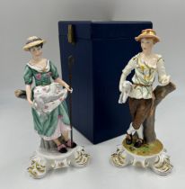 Two Royal Crown Derby figures of shepherdess with lambs and detachable metal crook. Signed Joan Lee.