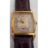 A Bulova two tone dial art deco quartz wristwatch on brown leather strap. In red box.