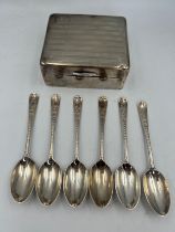A set of six silver spoons, London 1921 together with a silver cigarette box. Weight of spoons 65.