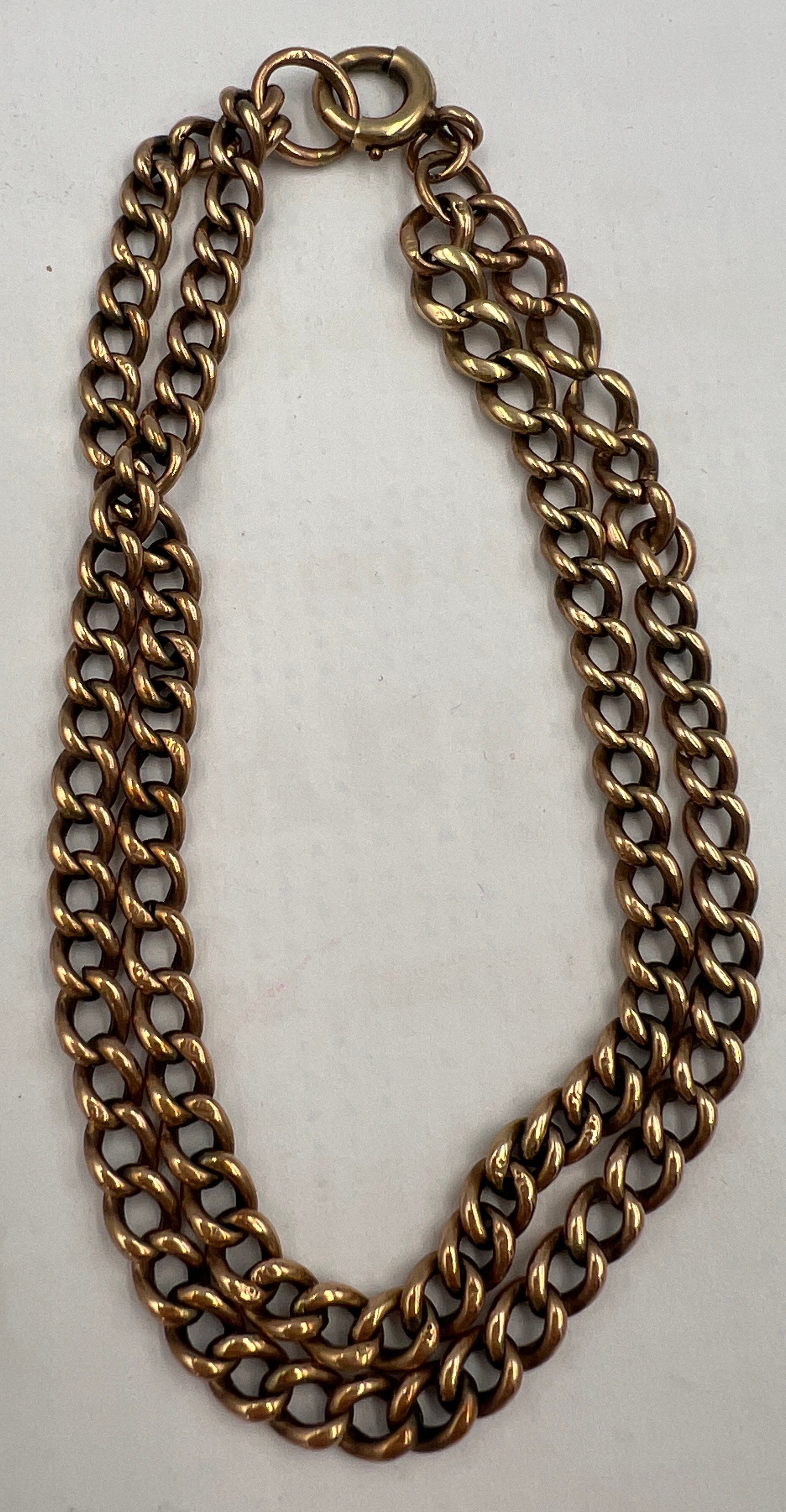 A 9 carat gold double chain bracelet. Weight 11.9gm.