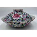 A Chinese porcelain famille rose bowl and cover, enamelled with millefleurs decoration and 6