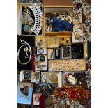 A large quantity of vintage costume jewellery to include jet, silver, coral etc.