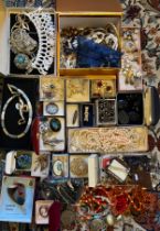 A large quantity of vintage costume jewellery to include jet, silver, coral etc.