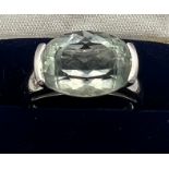 A 9 carat white gold ring set with pale blue stone. Size N. Weight 3.5gm.