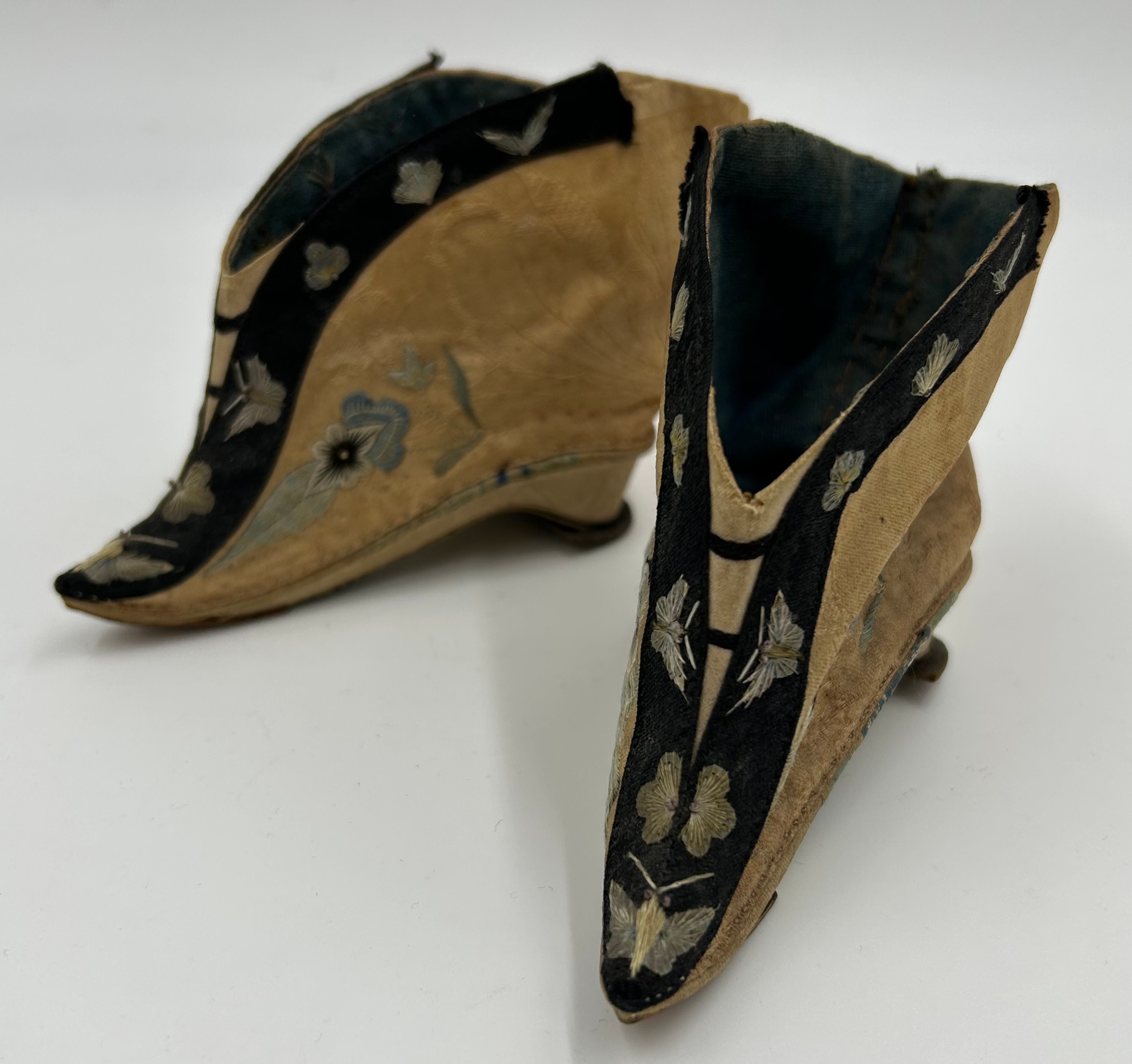 Chinese silk embroidered foot binding lotus shoes.