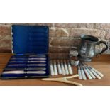 A miscellany to include 6 mother of pearl handled walnut picks, boxed silver handled dessert knives,