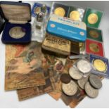 A miscellany to include vintage tins, coins, crowns, nickel silver York Minster medal, glass cruet