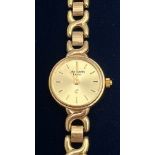 A nine carat yellow gold ladies wristwatch. Marked to face John Hawley Exeter. 18cm l. Weight 15.