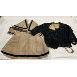 Two Victorian items of clothing to include a child’s dress in brown with black velvet trim, lace