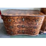 An 18thC Austrian parquetry inlaid serpentine fronted chest of three drawers with brass fittings, on