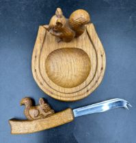 Squirrel Man- Trevor Hutchinson - An oak horseshoe ashtray, 12 w x 13 d x 8cm h H7cm together with