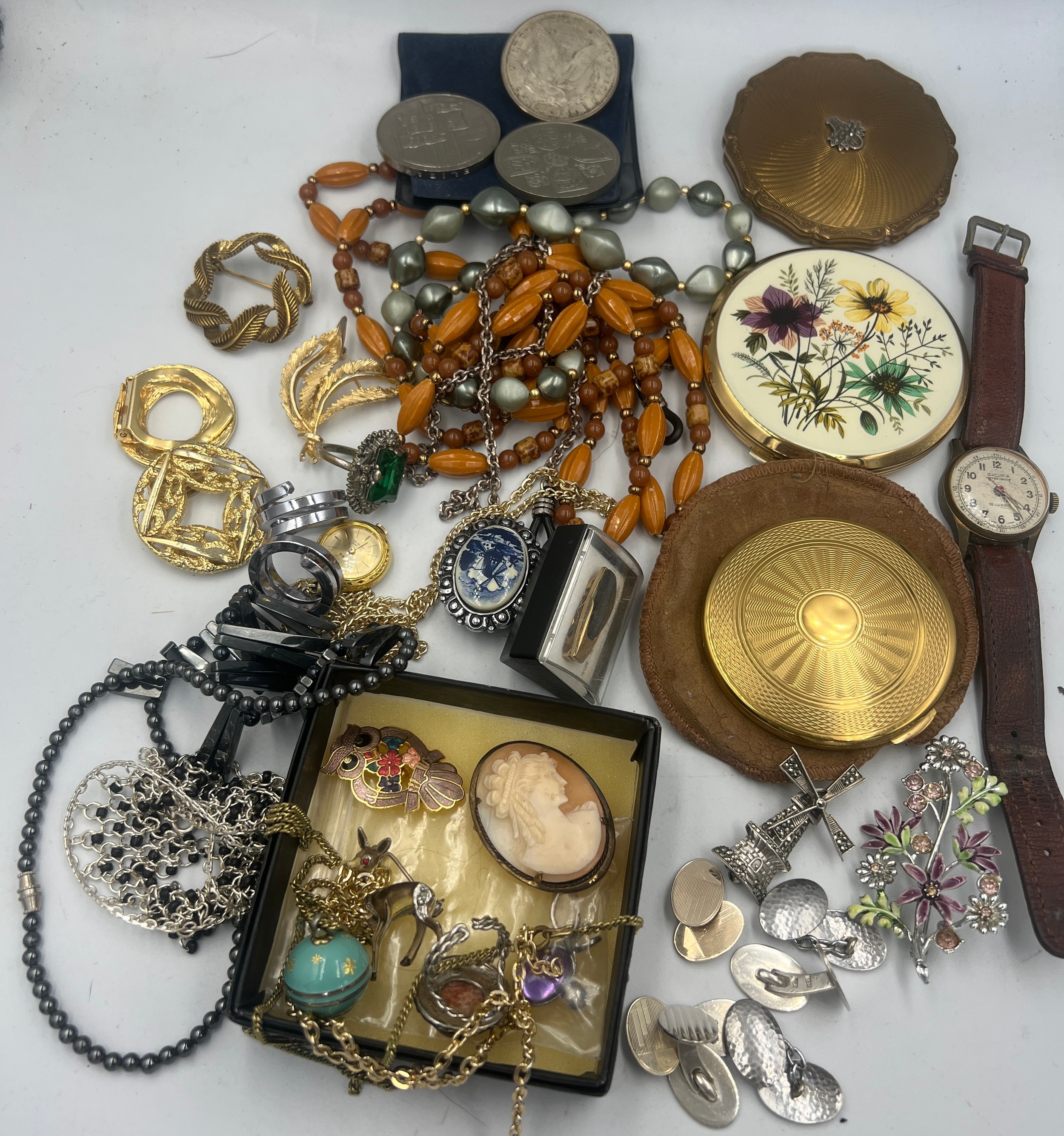 A quantity of costume jewellery and compacts to include two Stratton compacts, silver cufflinks,