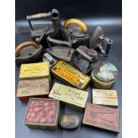 A collection of sad irons, CH Crane, Otto etc together with various tins to include Rowntree's