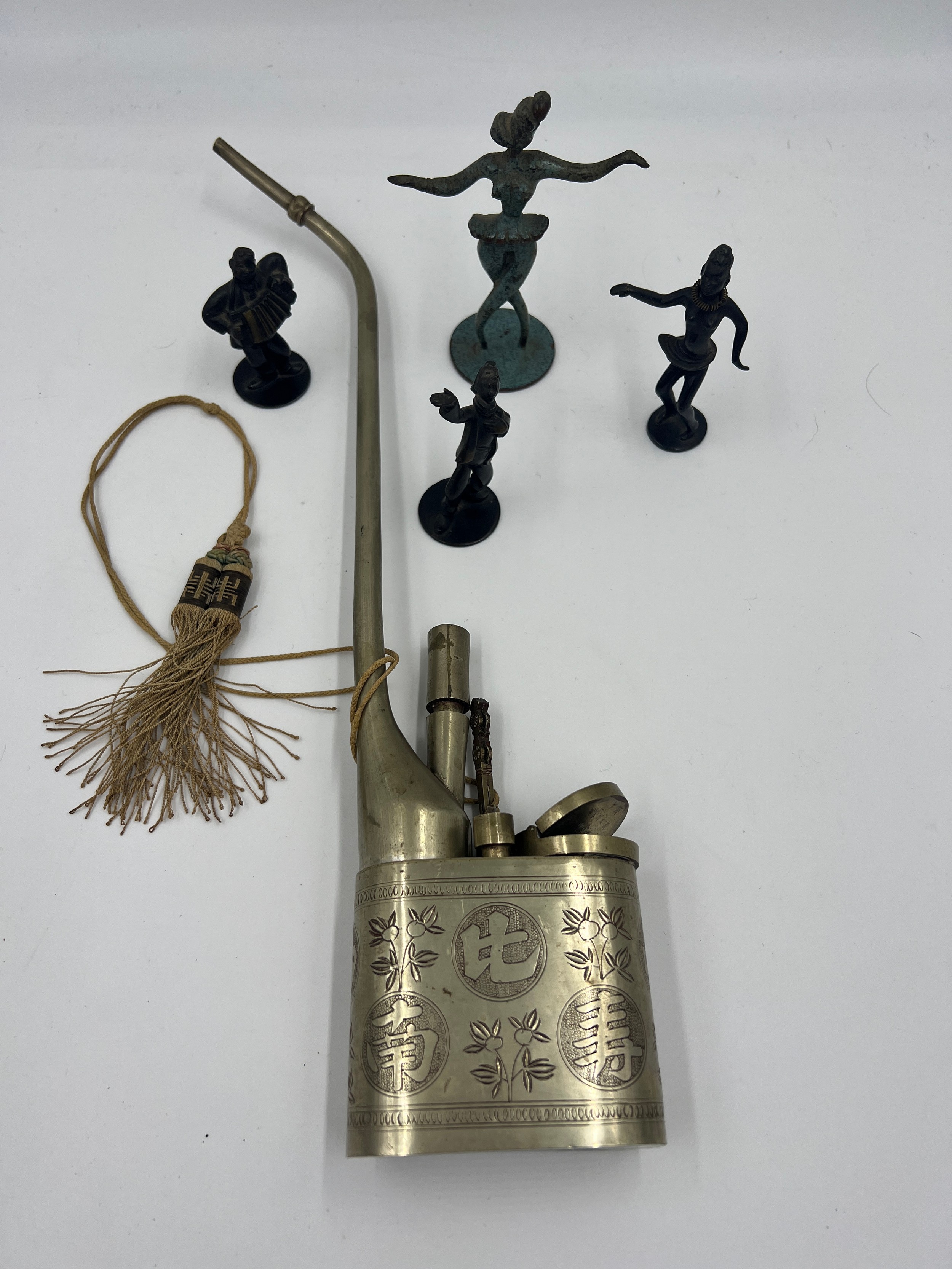 Four metal figures and a Chinese metal opium pipe. - Image 4 of 4