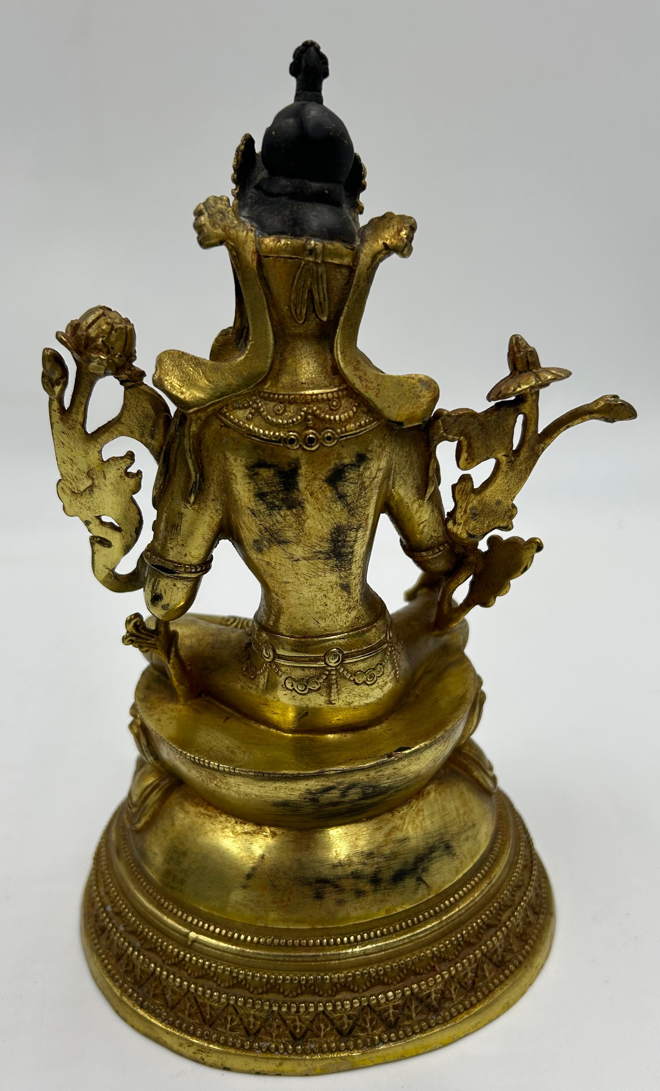 A Tibetan bronze seated figure of Green Tara 22cm h together with a heavy brass hand crafted meditat - Image 9 of 9