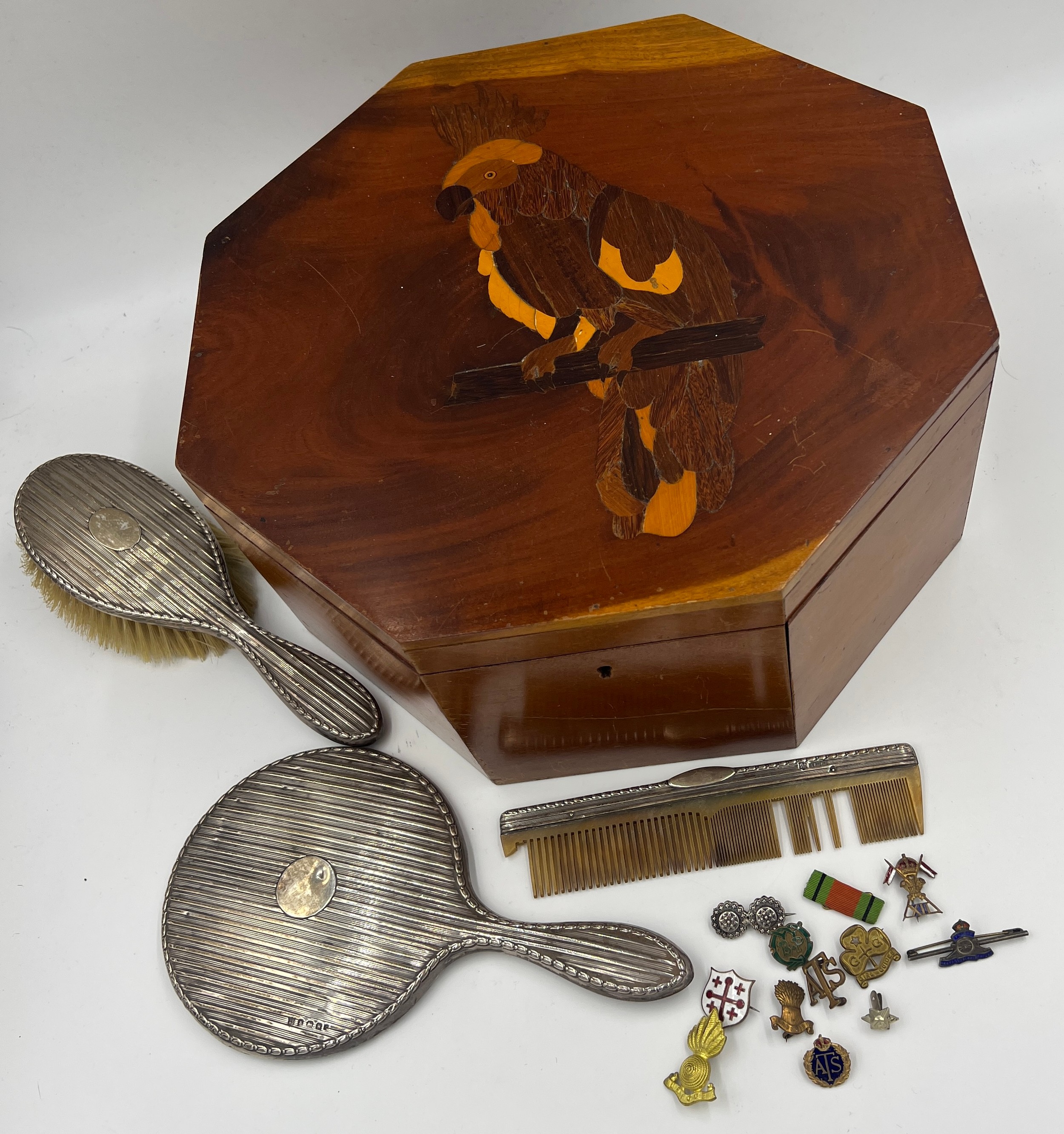 A miscellany to include an octagonal inlaid box, silver backed mirror, brush, comb and various