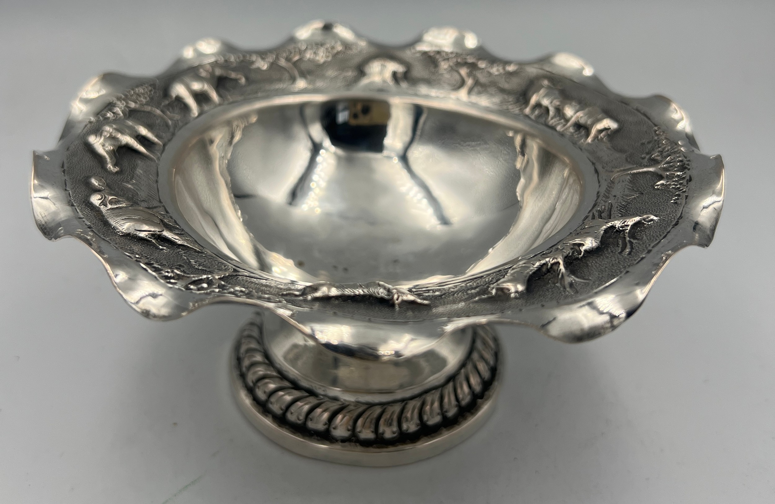 Two Indian white metal bowls, one on a pedestal and embossed with elephants and other animals, the - Image 4 of 7