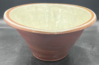 A Victorian cream glazed bread mixing bowl. 42cm d.