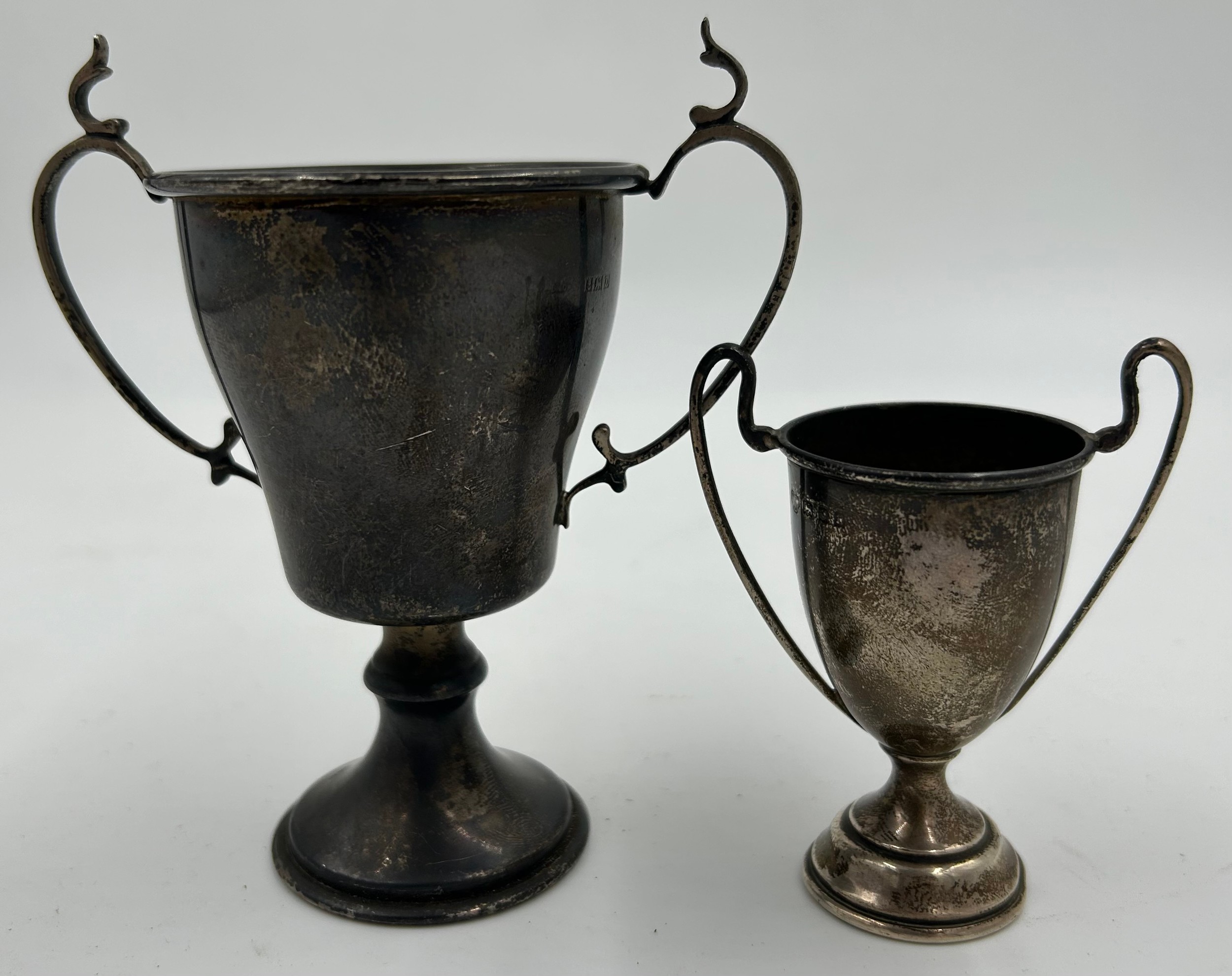 Two hallmarked silver presentation cups, no engraving. Total weight 90.4gm. Largest 12cm h.