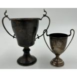 Two hallmarked silver presentation cups, no engraving. Total weight 90.4gm. Largest 12cm h.