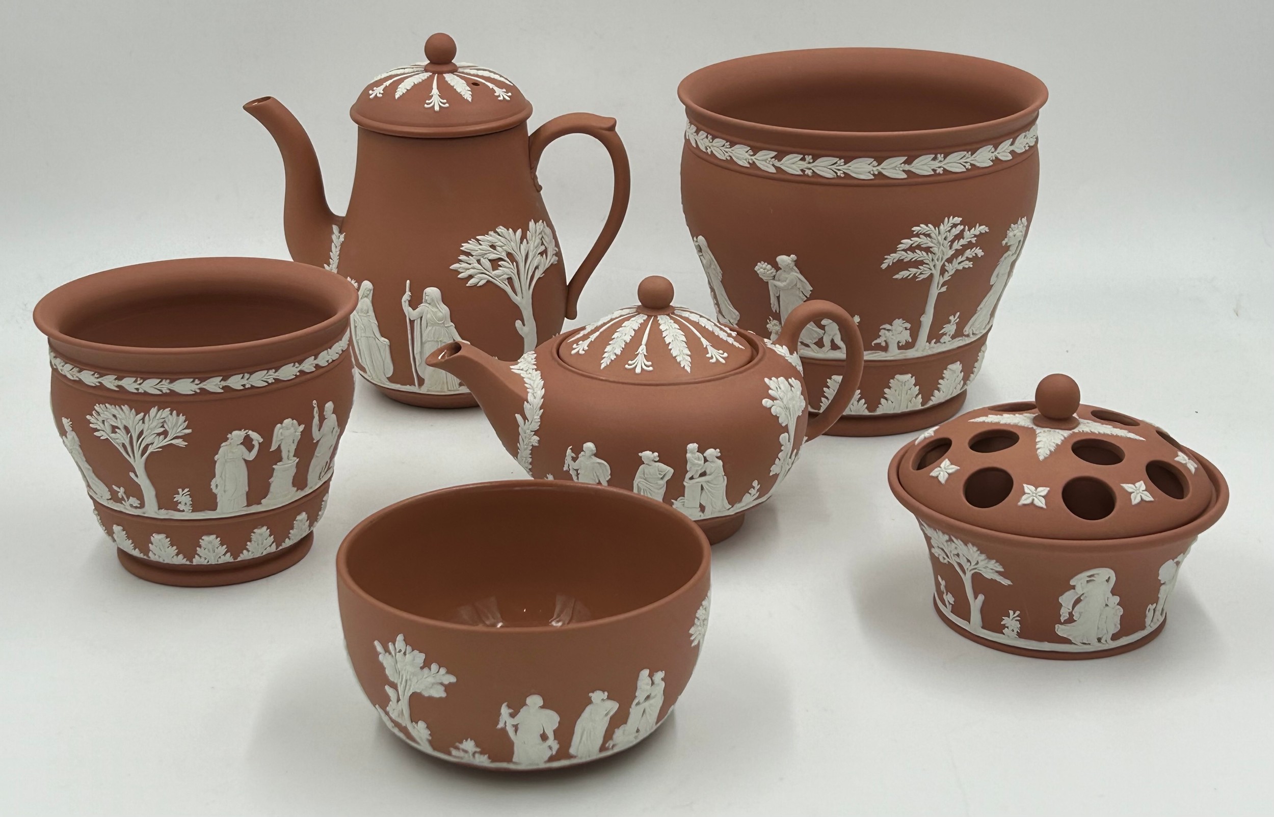 A collection of Wedgwood Terracotta Jasper Ware pottery to include a coffee pot 18cm h, a teapot