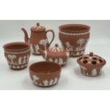 A collection of Wedgwood Terracotta Jasper Ware pottery to include a coffee pot 18cm h, a teapot