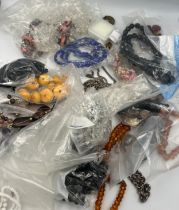 A quantity of vintage jewellery to include bead necklaces, loose beads, micro mosaic brooches, lapis