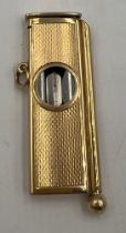 A nine carat gold cigar cutter and piercer. 5.5cm x 2cm. Weight 15.8gm. Birmingham 1990. Maker S J