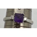 A 9 carat white gold ring set with amethyst and diamond. Size Q. Weight 2.6gm.