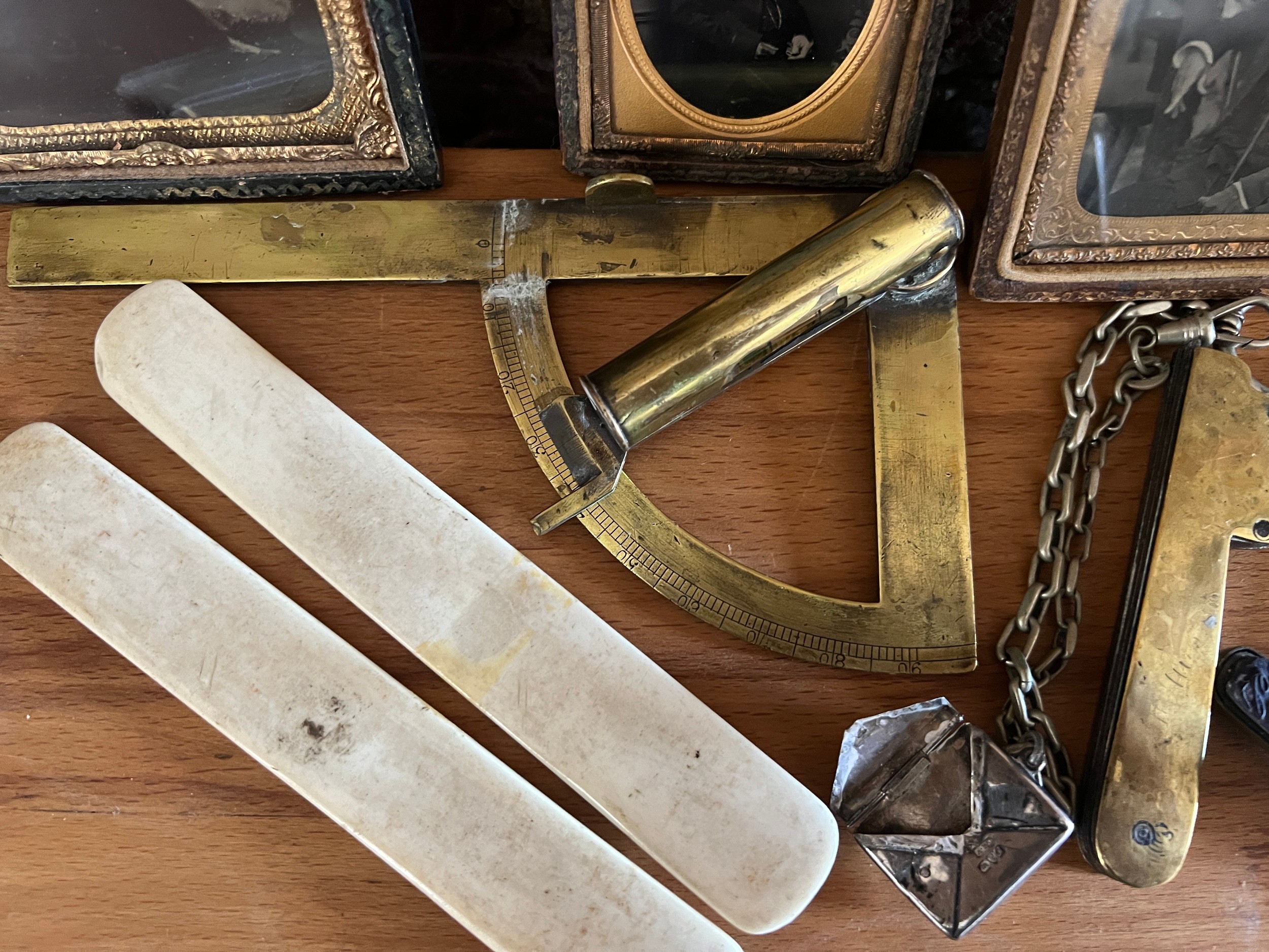 A miscellaneous lot to include daguerreotypes, a brass protractor/spirit level, a brass fleam, a - Image 6 of 7