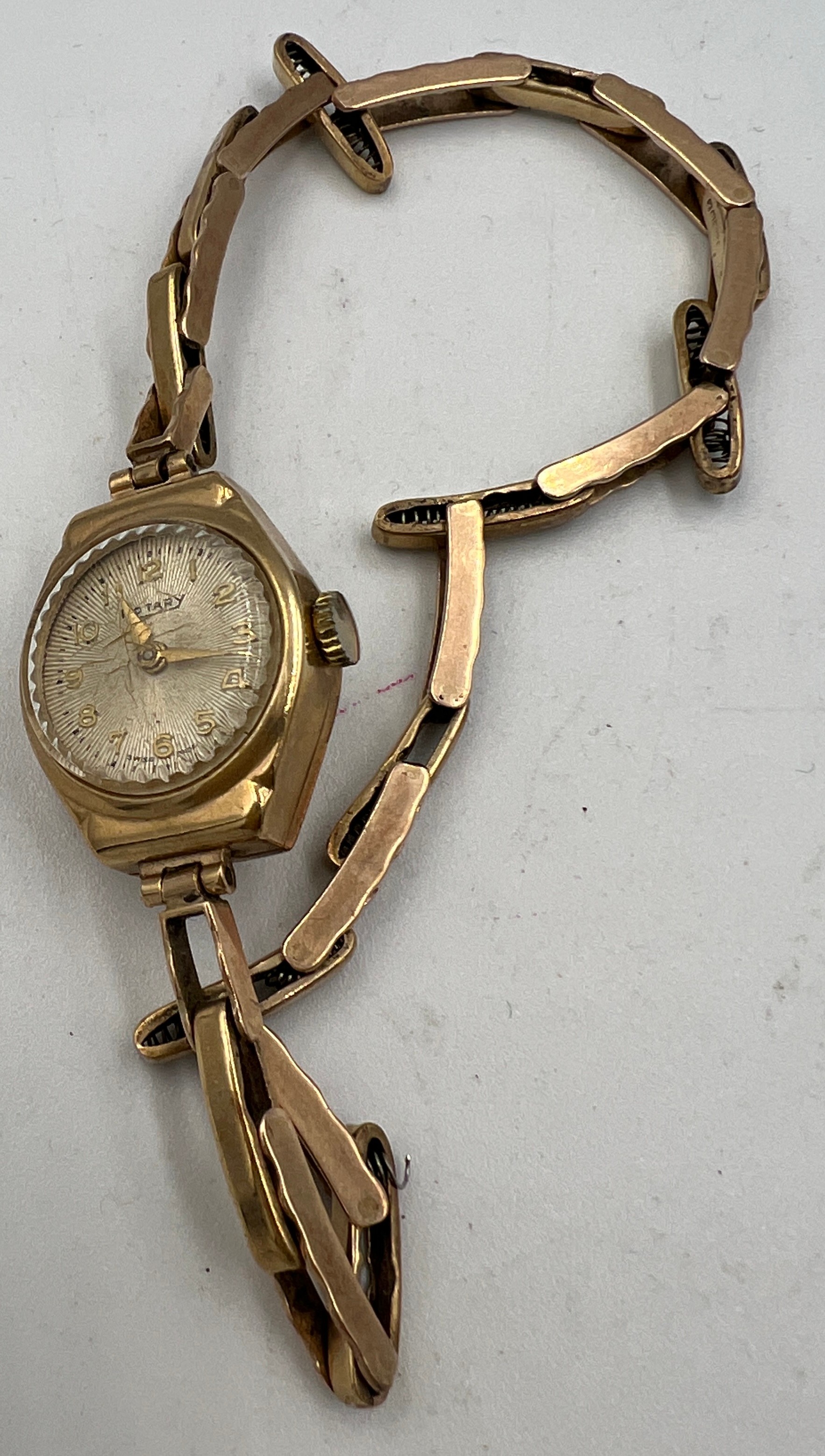 A 9 carat gold ladies Rotary wristwatch with 9 carat gold expanding bracelet. Total weight 13.6gm.