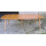 A mid 20thC Ercol extending dining table. Closed 82cm h x 152cm l x 91cm w, fully open 223cm l.