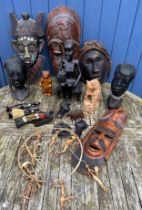 Tribal and African wooden items to include 4 hanging wall masks, one Indonesian with mother of pearl