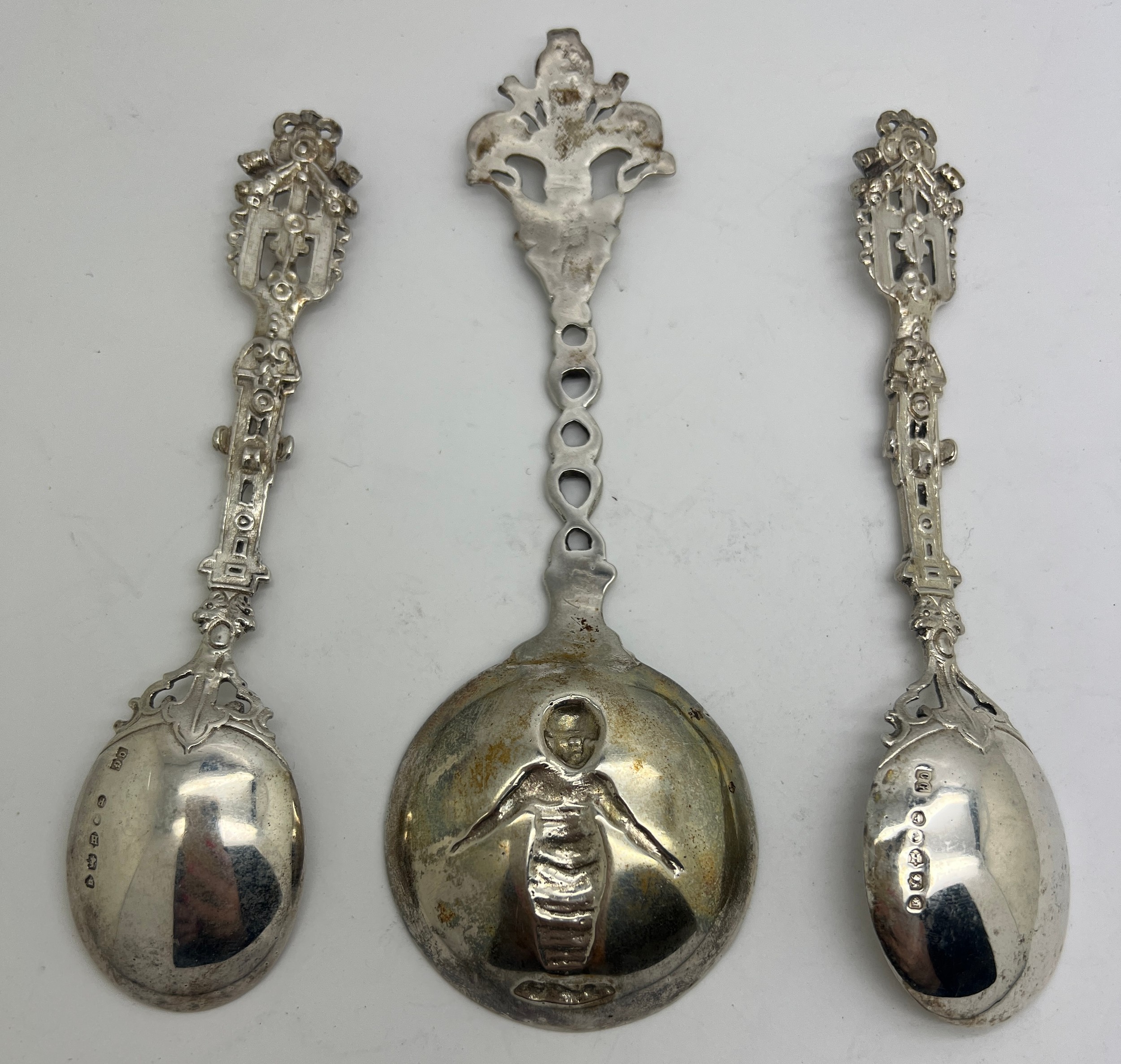 Three decorative spoons, two silver with import marks London 1883 CG and an unmarked white metal - Bild 2 aus 2