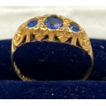 An 18 carat gold ring set with sapphires and diamonds. Size P/Q. Weight 2gm.