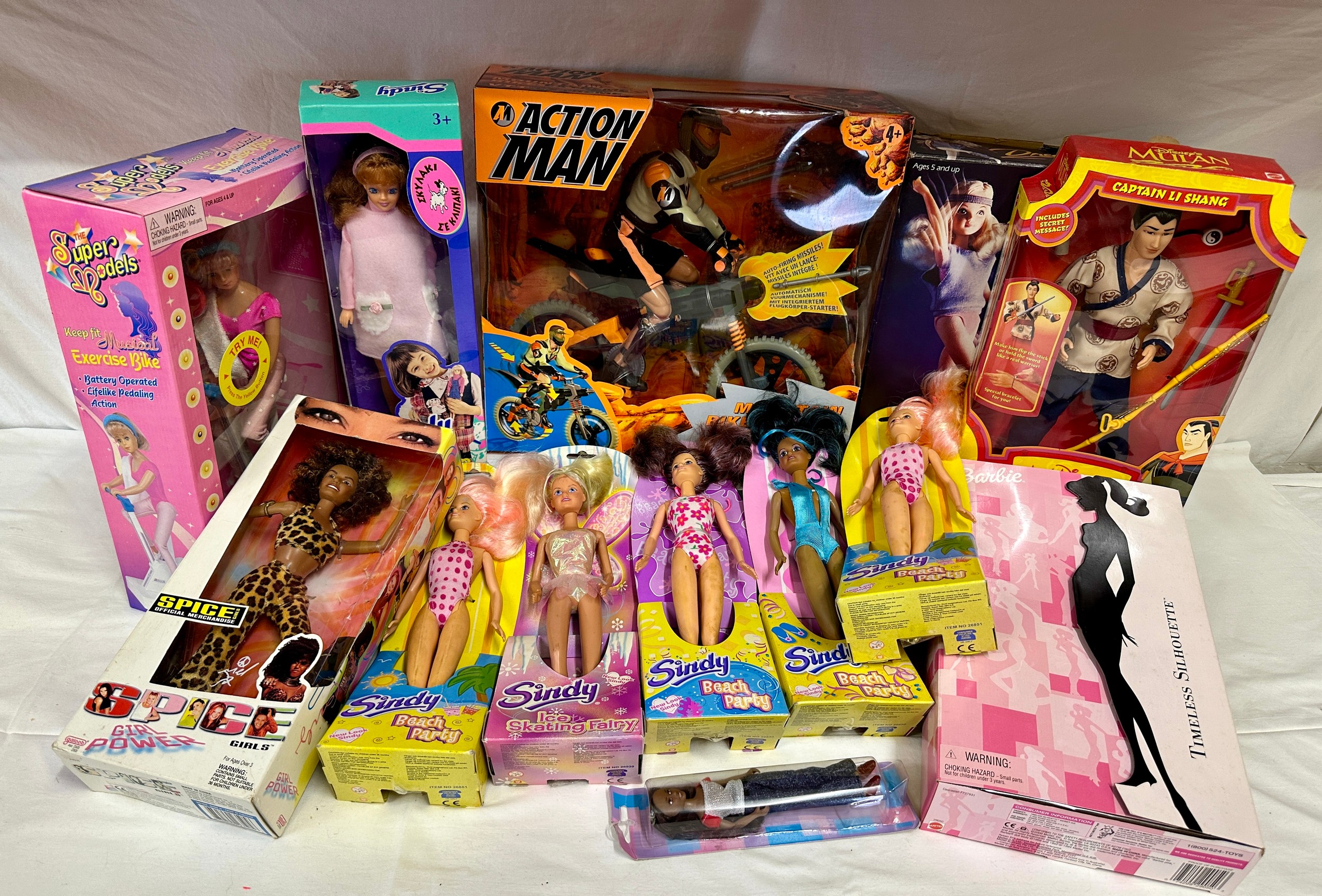 A collection of vintage toys to include Barbie Timeless Silhouette, six Sindy dolls 4 x beach