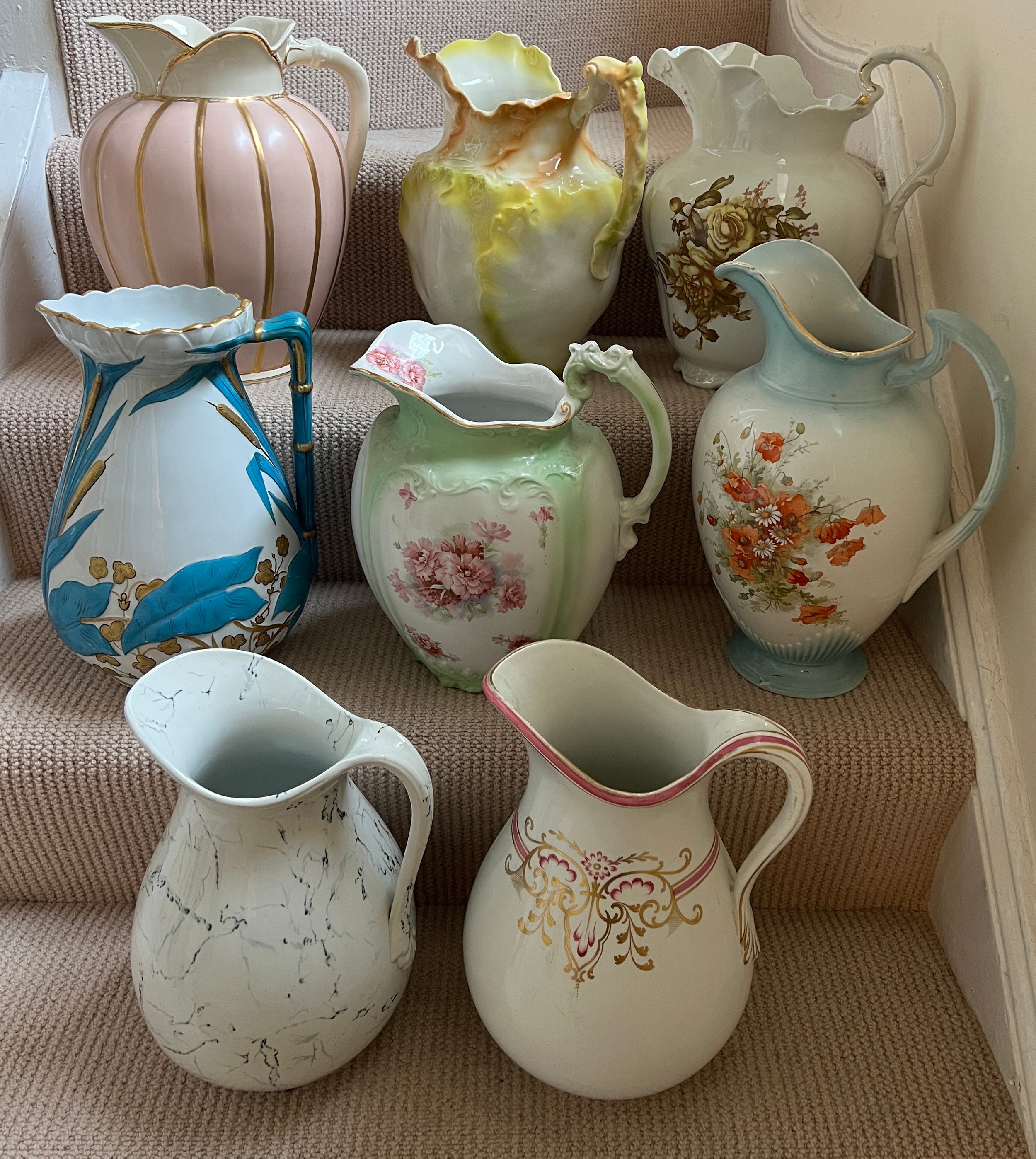 Eight various late 19th century toilet jugs. Tallest 35cm h.