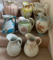Eight various late 19th century toilet jugs. Tallest 35cm h.