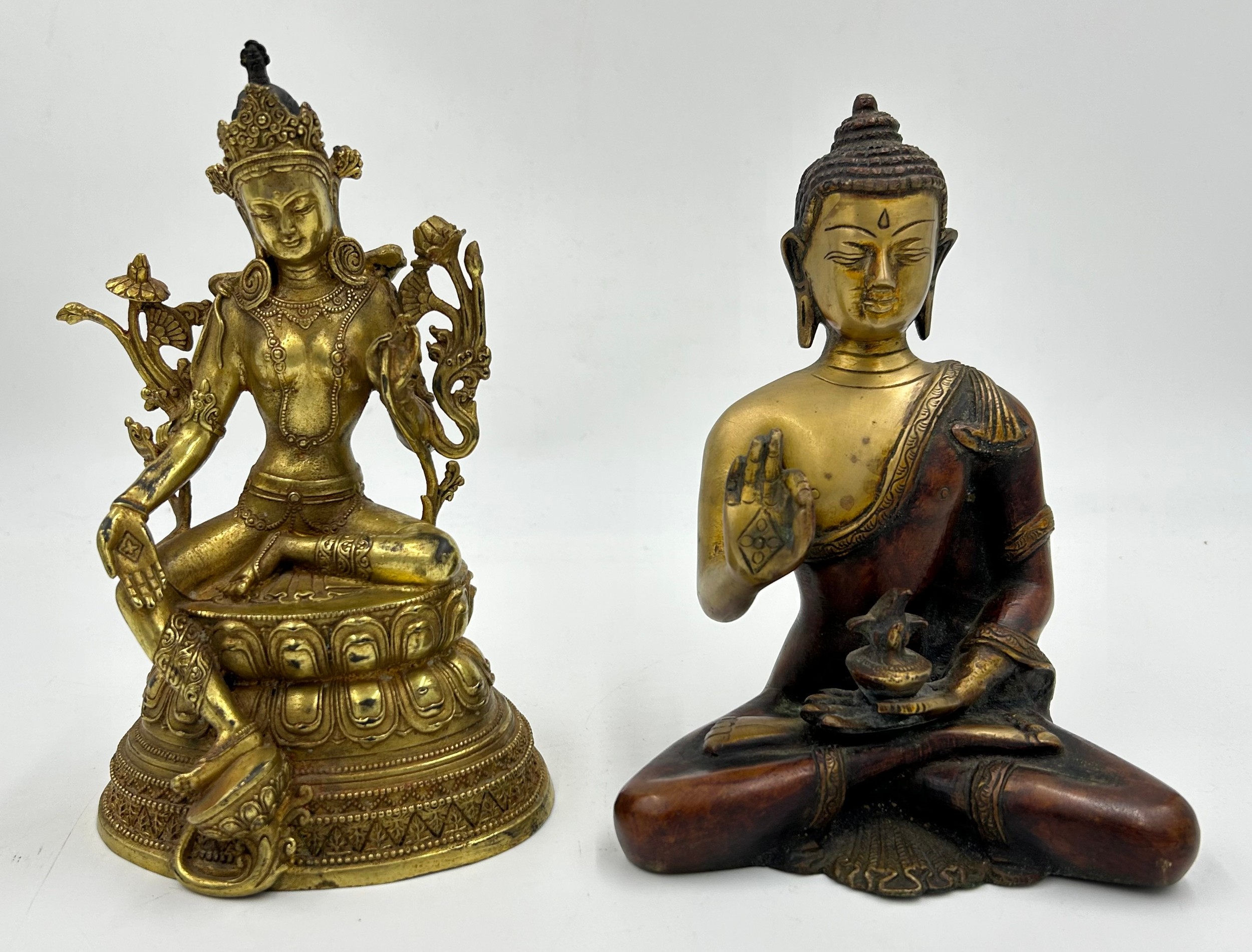 A Tibetan bronze seated figure of Green Tara 22cm h together with a heavy brass hand crafted meditat