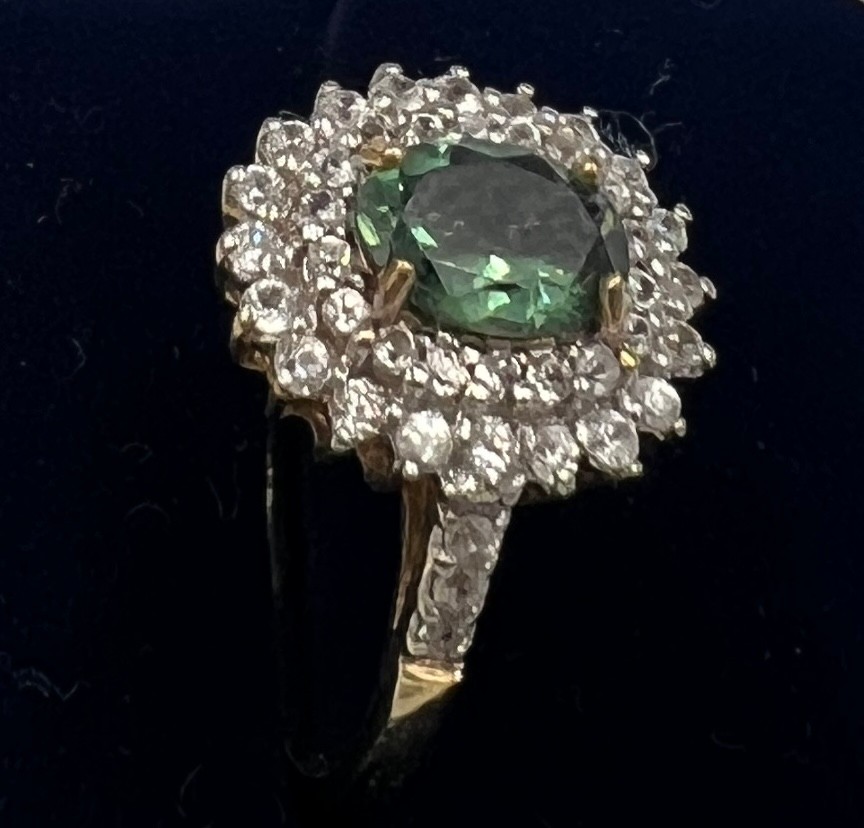 A 9 carat gold ring set with green and clear stones. Size P. Weight 3gm. - Image 2 of 2