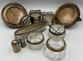 A quantity of hallmarked silver to include silver rimmed glass salts, salt spoons, small pepperette,