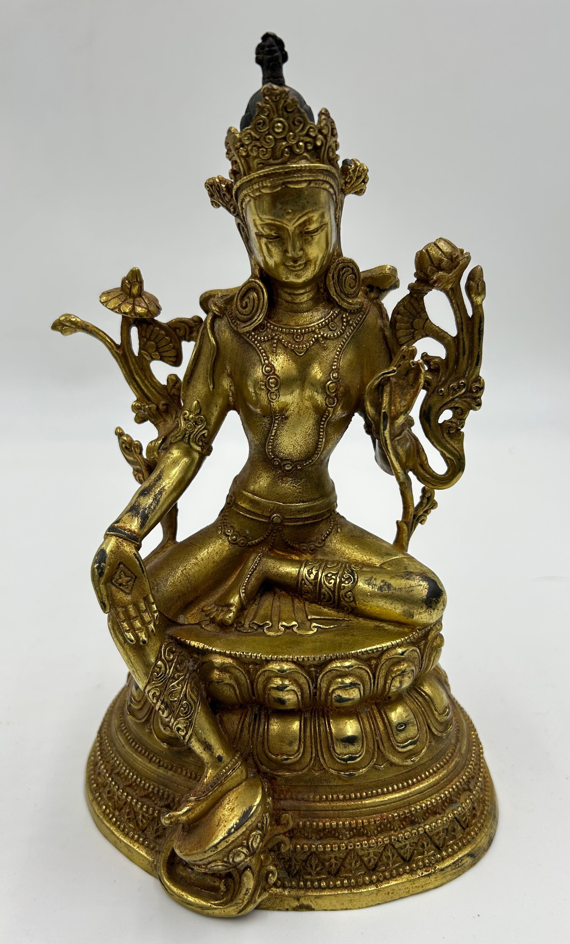 A Tibetan bronze seated figure of Green Tara 22cm h together with a heavy brass hand crafted meditat - Image 8 of 9