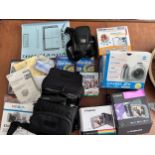 A collection of camera equipment to include Fujifilm Instant Camera Instax Wide 300, Polaroid