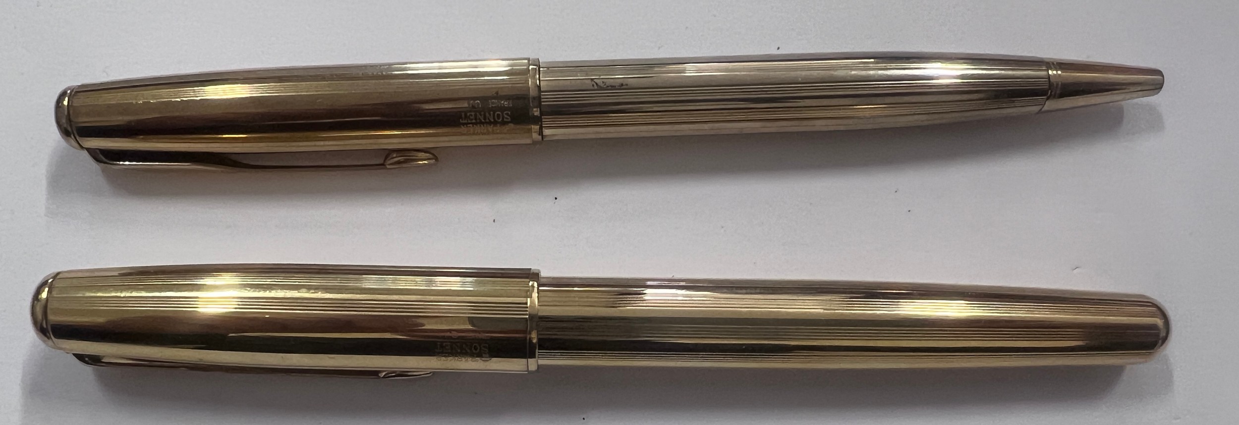 Two gold plated Parker Sonnet pens to include a fountain pen and biro.