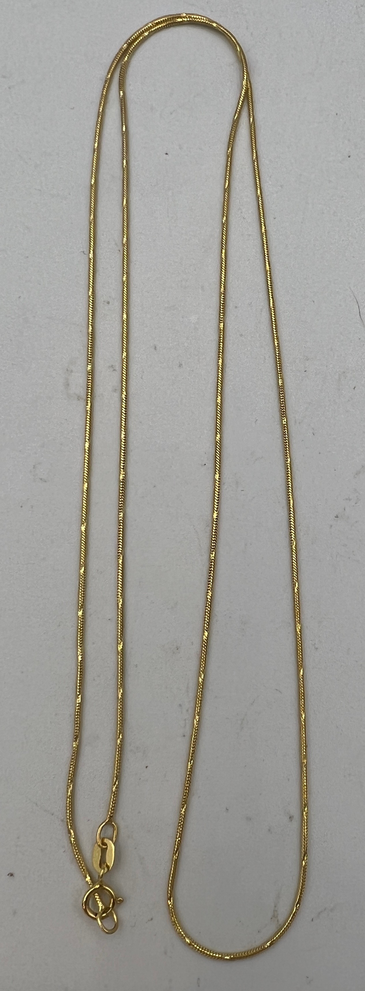 A fine gold chain necklace marked .585 (14 carat gold) Length 54cm. Weight 3.3gm.