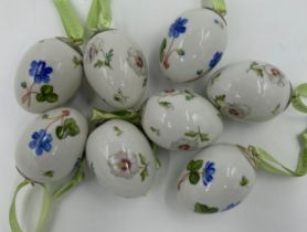 A collection of eight Royal Copenhagen porcelain eggs, 4 x blue hepatica and 4 x pansy. 5.5cm.