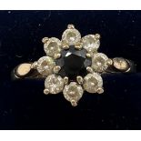 A nine carat gold cluster ring with sapphire and diamonds. Size R. Weight 2.2gm.