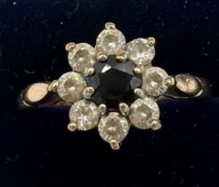 A nine carat gold cluster ring with sapphire and diamonds. Size R. Weight 2.2gm.